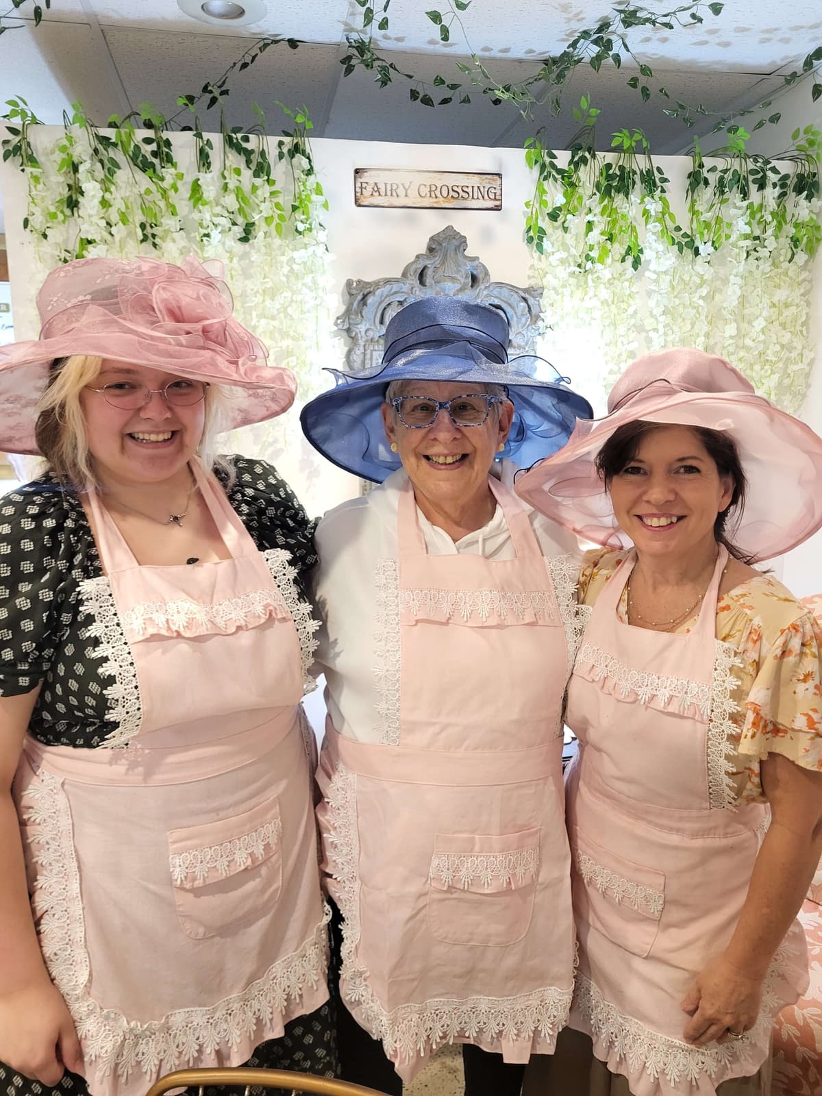 Bimble & Be staff wearing fancy hats for afternoon tea