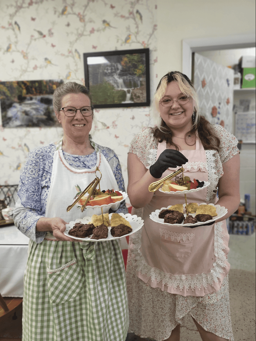 Staff presenting afternoon tea trays